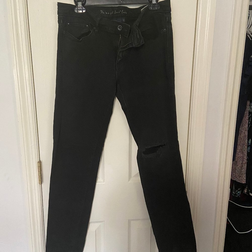 Levi's black low skinny jeans with hole in knee